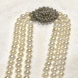 Three strands of Japanese akoya pearls 6-6.5mm Antique 14k white gold clasp with diamonds Shortest strand 16 inches longest 18inches